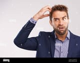 that-left-him-completely-baffled-studio-shot-of-a-handsome-man-with-a-confused-expression-2M6X5FN-847430131