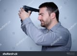 stock-photo-frantic-man-shooting-himself-with-a-gun-618442790