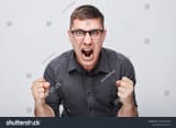 stock-photo-portrait-of-angry-young-man-yelling-clenching-fists-isolated-on-white-studio-background-devil-face-2355336383
