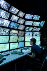 saint-petersburg-russia-december-rear-view-man-looking-multiple-computer-screens-monitoring-system-displays-166745674