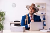 young-businessman-cowboy-working-office-600nw-1935944929