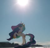 3613805__safe_artist-colon-dingopatagonico_princess+celestia_alicorn_pony_g4_blurry+background_irl_photo_rearing_solo_sun_sunny+day_toy