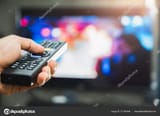 holding remote stock photo