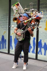 800px-One-man_band_street_performer_-_5