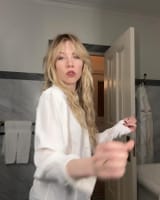 Photo by Carly Rae Jepsen on March 26, 2025. May be an image of 1 person, blonde hair, make-up, slip, dressing gown, robe and text.