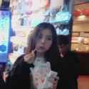 VERY_cute_and_tiny_heejin_eating_taiwanese_popcorn_chicken_and_dancing_to_christmas_music_on_Jishan_St,_Jioufen,_Taiwan_thumb.jpg