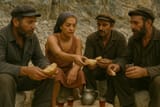 Rita Ora breaks bread with her fellow miners