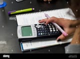 female-student-with-dark-nail-polishuses-graphing-calculator-over-C5DD4C