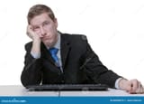 business-man-bored-work-businessman-sitting-his-desk-86055079