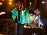Ozzy Osbourne shows the flag of brazil while performing in Argentina