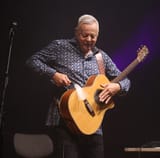 TommyEmmanuelBeatingHisGuitar