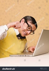 stock-photo-young-nerd-sitting-at-the-computer-231847684