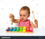 stock-photo-baby-playing-xylophone-isolated-on-white-ramy148622672-2761129901