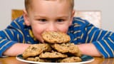 national-cookie-day-Boy-gazing-at-cookies