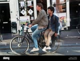 two-men-sharing-a-bicycle-in-amsterdam-EREB84