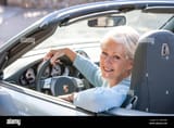 senior-woman-in-her-sports-car-2A85NBK