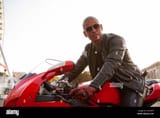 handsome-male-biker-wearing-leather-jacket-and-sunglasses-sitting-on-a-motorbike-copy-space-2C045KP