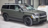 2024_Hyundai_Santa_Fe_Calligraphy_AWD_in_Rockwood_Green_Pearl,_front_right