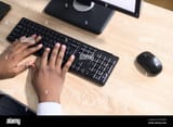 top-view-hands-of-an-african-american-guy-typing-on-the-laptop-keyboard-close-up-fingers-typing-programmer-developer-software-journalist-writing-2E97NDG-4048122040