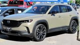 2023_Mazda_CX-50_GT_in_Zircon_Sand_Metallic,_Front_Left,_06-18-2022