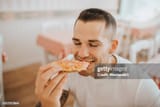 dude eating pizza like every other single human on earth