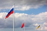 historical-flags-russian-empire-ussr-state-flag-federation-flying-air-blue-sky-white-cumulus-clouds-national-334096938-661573599