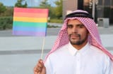 attractive-arabic-gay-man-holding-rainbow-flag-156705897