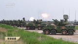 footage of PLA Type 625 anti-aircraft missile and gun systems firing , apparently at a cluster of drones