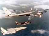 Tu-95 being escorted out of US airspace by F-14 and Harrier