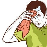 man_wiping_sweat_with_towel