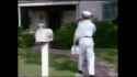 50s-america-is-a-jewish-psyop - Man in a white uniform stands in front of a house_thumb.jpg