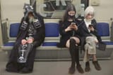 A monk and two worldly girls in the metro_1736290867439747