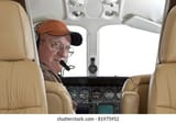 pilot-looking-back-passenger-compartment-260nw-81975952