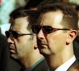 a-file-picture-dated-13-june-2000-shows-syrian-president-bashar-al-assad-and-his-younger