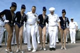 US_Navy_060525-N-9640H-043_Radio_City_Rockettes_show_a_couple_of_Sailors_how_to_perform_a_high_kick_from_their_famous_precision_dance_routine_during_an_event_for_Fleet_Week_New_York