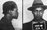 2560px-Malcolm_X_mugshot_1944