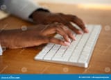 close-up-female-hands-typing-computer-keyboard-african-american-130537538-2703381760