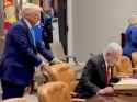 trump pulling chair_thumb.jpg