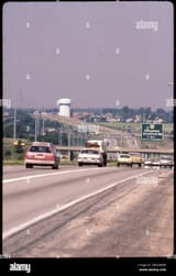 a-1980-view-of-interstate-270-showing-a-highway-sign-for-exit-22-indicating-ohio-route-315-columbus-and-stratford-road-one-mile-ahead-a-water-tower-is-visible-in-the-background-3BGGWPM
