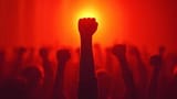 ai-generated-silhouetted-hands-raised-in-solidarity-at-rally-with-warm-backlighting-photo