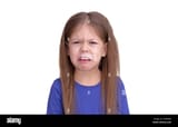 dissatisfied-child-kid-with-disgust-on-sour-face-isolated-on-white-background-looking-at-camera-waist-up-caucasian-little-girl-of-5-years-in-blue-2HF66MJ