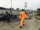 african man skinned the lorax as the locals look in fear of the nigler