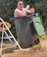 Baz in a jacuzzi enjoying his drink