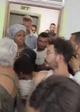 israelis in bomb shelter