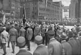 Adolf Hitler, Julius Streicher and other dignitaries review passing Nazi Party members at the Deutscher Tag [German Day] celebration in Nuremberg. 1923 Sep 02