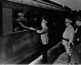 Adolf Hitler says goodbye to departing Benito Mussolini. Next to the platform you can see Hermann Goring (in a bright uniform) and Joachim Ribbentrop 1944-07-20
