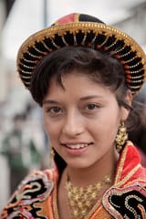 70435677-Portrait-of-young-peruvian-girl-with-tradtional-dresses-during-a-procession-in-Cusco-Cuzco-Peru-Andes-South