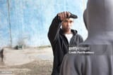 attacker-pointing-gun-at-man[1]