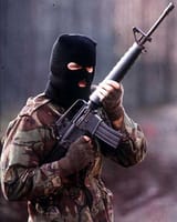 a-volunteer-of-the-irish-republican-army-on-active-service-in-the-british-occupied-north-of-ireland-armed-with-an-american-supplied-m16-assault-rifle-early-1980s