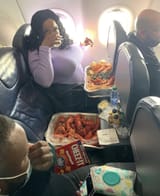fat niggers on a plane eating lobster, on your DIME